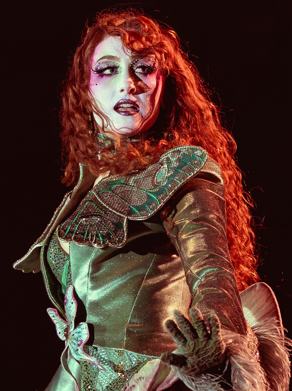 Chappell Roan performing in a fully covered stage costume