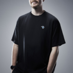 MrBeast wearing a black shirt in a studio portrait