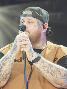 Jelly Roll singing into a microphone at the 2024 Global Citizen Festival