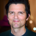 Portrait of Adam Scott in 2023