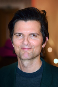 Portrait of Adam Scott in 2023