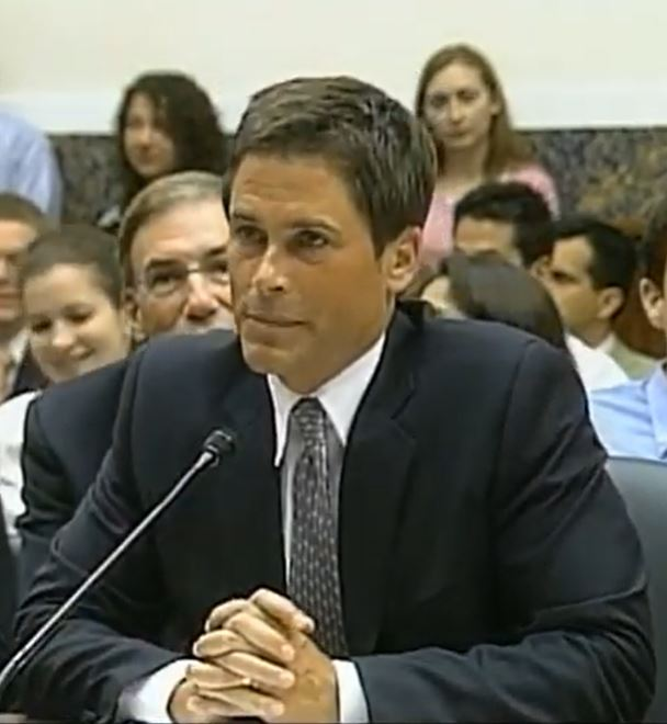 Rob Lowe speaking in 2011, wearing a suit and tie