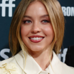 Sydney Sweeney wearing a cream collared outfit at the 2024 Toronto International Film Festival