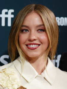 Sydney Sweeney wearing a cream collared outfit at the 2024 Toronto International Film Festival